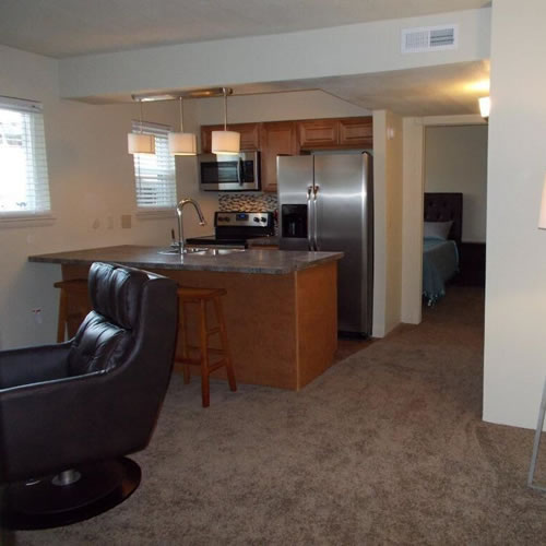 Affordable apartment building in Northwest Wichita with parking lot and simple exterior design