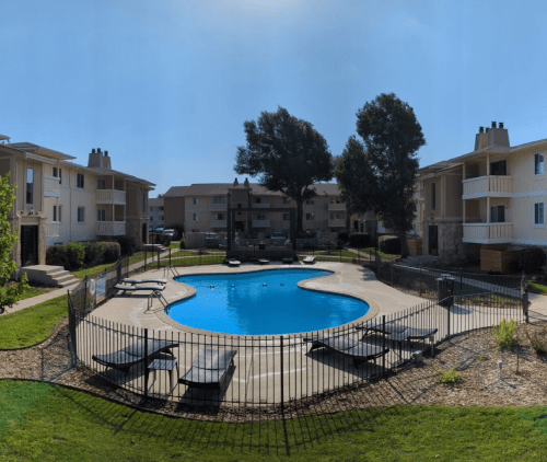 Luxury apartment interior in Wichita featuring granite countertops, stainless steel appliances, and open layout