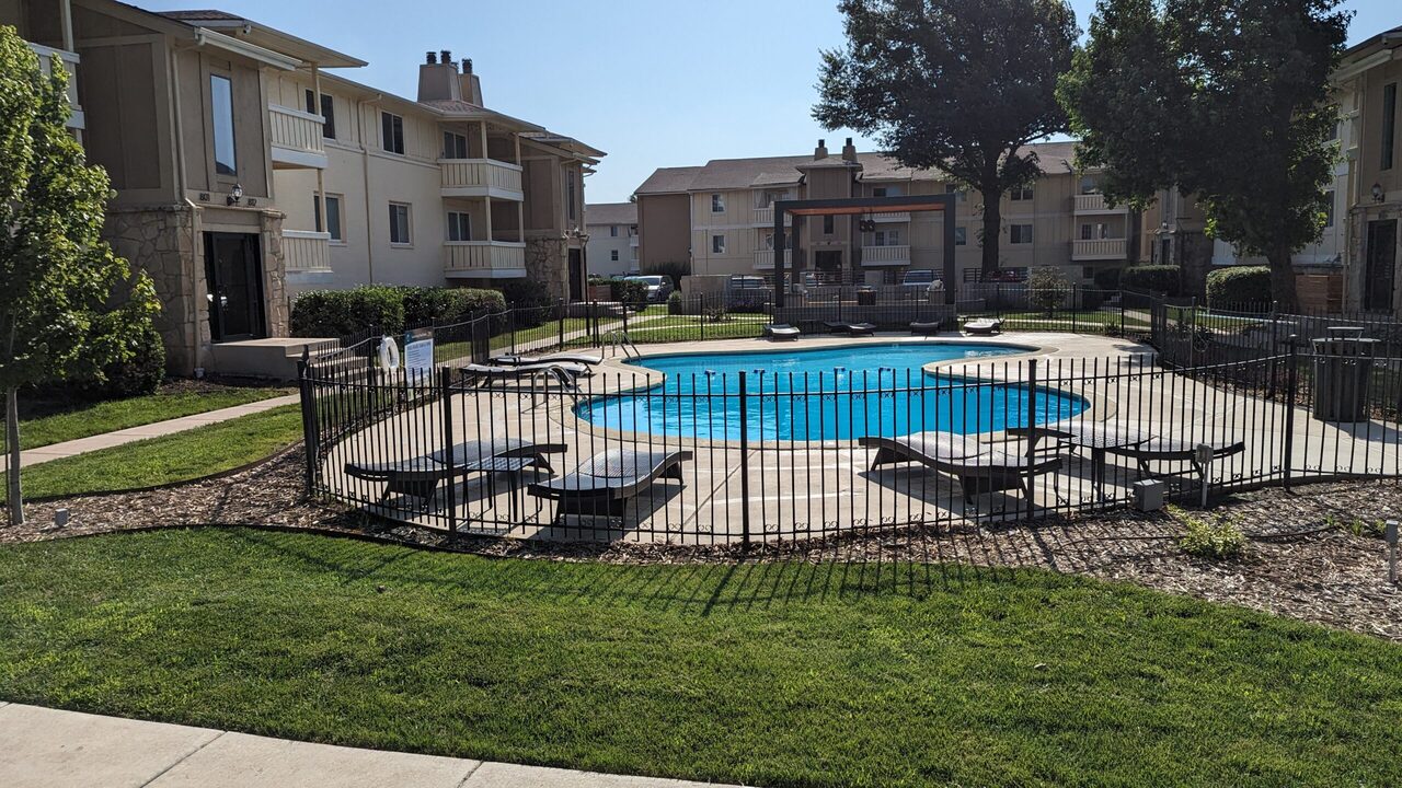 Benefits of apartment living with maintenance-free community and residents enjoying relaxed lifestyle